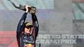 Red Bull Racing's Dutch driver Max Verstappen hoists the trophy on the podium after winning the United States Formula One Grand Prix at the Circuit of the Americas in Austin, Texas, on October 19, 2025. 
Jim WATSON / AFP