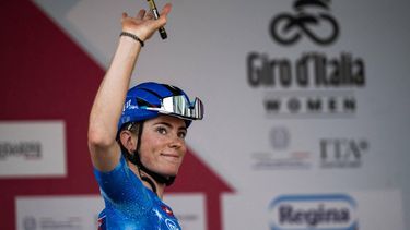 FDJ Suez's Dutch cyclist Demi Vollering, wearing the best climber's blue jersey (Maglia Azzurra), waves during the pre-stage presentation ahead of the 9th stage of the Giro d'Italia Women 2026 between Saluzzo and Saluzzo in Saluzzo on June 7, 2026. 
MARCO BERTORELLO / AFP