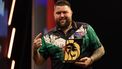 England's Michael Smith poses with his trophy after winning his final darts match against Wales' Gerwyn Price on Night 1 of the PDC Premier League, at the Utilita Arena in Cardiff, south Wales on February 1, 2024. 
Adrian DENNIS / AFP