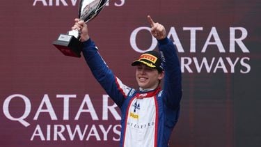 Third-placed Trident driver Laurens van Hoepen of the Netherlands celebrates on the podium after the Round 1 Melbourne Feature Race of the Formula 2 Championship at Albert Park Circuit on March 8, 2026, ahead of the Formula One Australian Grand Prix. 
Martin KEEP / AFP