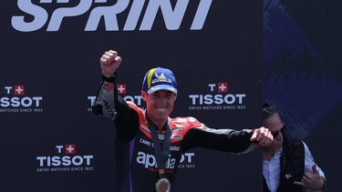 Aprilia Spanish rider Aleix Espargaro celebrates on the podium after winning the MotoGP Sprint Race of the Moto Grand Prix of Catalonia at the Circuit de Catalunya on May 25, 2024 in Montmelo on the outskirts of Barcelona. 
LLUIS GENE / AFP