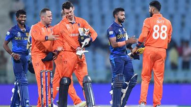 2023-10-21 14:55:57 Sri Lanka's Sadeera Samarawickrama (2R) shakes hands with Netherlands' Aryan Dutt (R) as his teammate Dushan Hemantha (L) watches at the end of the 2023 ICC Men's Cricket World Cup one-day international (ODI) match between Netherlands and Sri Lanka at the Ekana Cricket Stadium in Lucknow on October 21, 2023. 
Noah SEELAM / AFP