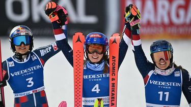 US Mikaela Shiffrin (C) winner, celebrates with Croatia's Zrinca Ljutic, second and US Paula Moltzan, third, after the second run of the Women's Slalom event during the FIS Alpine Skiing World Cup in Sestriere, Italy, on February 23, 2025. 
Marco BERTORELLO / AFP