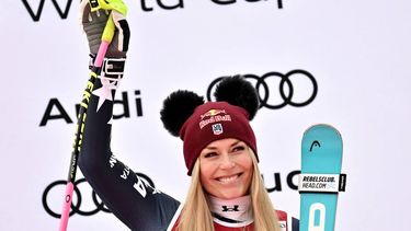 Third-placed US Lindsey Vonn celebrates on the podium of the women's Super G event during the FIS Alpine Ski World Cup 2025-2026, in Val d'Isere, southwestern France, on December 21, 2025. 
Jeff PACHOUD / AFP
