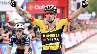 2023-09-02 17:43:57 Stage winner Team Jumbo's Slovenian rider Primoz Roglic celebrates followed by Team Quick Step's Belgian rider Remco Evenepoel (L) as he crosses the finish line in first place during the stage 8 of the 2023 La Vuelta cycling tour of Spain, a 165 km race from Denia to Xorret de Cati, in Castalla, on September 2, 2023. 
JOSE JORDAN / AFP