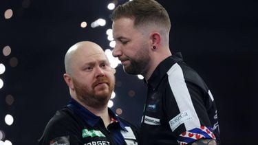 epa12610314 England’s Justin Hood (L) during his second round World Darts Championships match win over Danny Noppert of the Netherlands at Alexandra Palace in London, Britain, 23 December 2025. The sporting event runs from 11 December 2025 to 03 January 2026.  EPA/ANDY RAIN