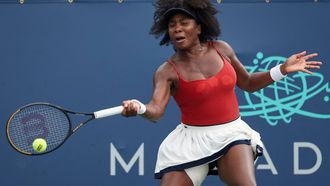 Venus Williams returns a shot against while playing with Hailey Baptiste (not pictured) against Shuai Zhang and Taylor Townsend during a women's doubles match on day 3 of the Mubadala Citi DC Open 2025 at William H.G. FitzGerald Tennis Center on July 23, 2025 in Washington, DC. Venus Williams, who made a comeback last week after more than a year's hiatus from competitive tennis, will compete alongside Reilly Opelka in mixed doubles at the US Open. Williams, a seven-time Grand Slam singles champion who turned 45 last month, and US compatriot Opelka were among 14 teams named on July 29, 2025 to the revamped August 19-20 event by the US Tennis Association.

Scott Taetsch / GETTY IMAGES NORTH AMERICA / AFP