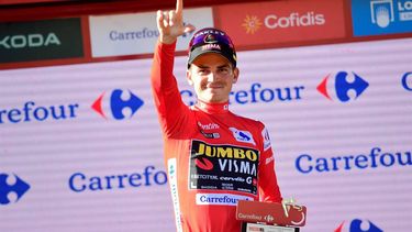 2023-09-09 17:56:43 Team Jumbo-Visma's US rider Sepp Kuss wearing the overall leader's red jersey celebrates on the podium after the stage 14 of the 2023 La Vuelta cycling tour of Spain, a 156,2 km race between Sauveterre-de-Bearn and Larra Belagua, on September 9, 2023. 
Ander GILLENEA / AFP