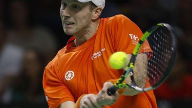 epa11729557 Botic Van de Zandschulp of the Netherlands plays a backhand in his match against Rafael Nadal of Spain during the Davis Cup quarterfinal between Netherlands and Spain at the Jose Maria Martin Carpena Sports Palace in Malaga, Spain, 19 November 2024.  EPA/Jorge Zapata