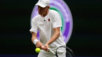 Italy's Jannik Sinner reacts as he practices with Serbia's Novak Djokovic on No. 1 Court at The All England Lawn Tennis and Croquet Club in Wimbledon, southwest London, on June 25, 2026, ahead of the 2026 Wimbledon Championships. 
Adrian Dennis / AFP