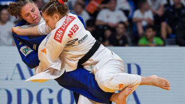 France's Manon Deketer (blue) and Netherlands' Joanne Van Lieshout (white) compete in the women's -63kg category during the European Championships judo in Podgorica, Montenegro, on April 24, 2025.  The tournament is taking place from 23 tot 27 April 2025.  
SAVO PRELEVIC / AFP