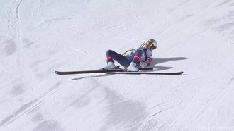This handout video grab from IOC/OBS shows US Lindsey Vonn crashing during the women's downhill event at the Milano Cortina 2026 Winter Olympic Games in Cortina d’Ampezzo on February 8, 2026. 
Handout / OIS/IOC / OBS / AFP