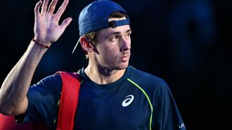 Australia's Alex de Minaur waves after being defeated by Italy's Jannik Sinner during their match at the ATP Finals tennis tournament in Turin on November 10, 2024. 
Marco BERTORELLO / AFP