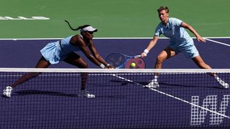 USA’s Asia Muhammad (L) and Netherland’s Demi Schuurs (R) play against Slovakia’s Tereza Mihalikova and Britain’s Olivia Nicholls during the women’s doubles final match at the BNP Paribas Open at the Indian Wells Tennis Garden in Indian Wells, California, on March 15, 2025. 
Patrick T. Fallon / AFP
