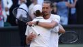 Italy's Jannik Sinner hugs Germany's Alexander Zverev (R) after winning during their men's singles final tennis match on the fourteenth day of the 2026 Wimbledon Championships at The All England Lawn Tennis and Croquet Club in Wimbledon, southwest London, on July 12, 2026. 
Henry NICHOLLS / AFP