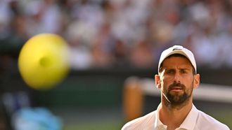 Serbia's Novak Djokovic reacts as he plays against Italy's Jannik Sinner during their men's singles semi-final tennis match on the twelfth day of the 2025 Wimbledon Championships at The All England Lawn Tennis and Croquet Club in Wimbledon, southwest London, on July 11, 2025. 
Glyn KIRK / AFP