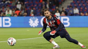 Paris Saint-Germain's Italian goalkeeper #01 Gianluigi Donnarumma dives for the ball during the warm up ahead of the French L1 football match between Paris Saint-Germain (PSG) and Stade Brestois 29 (Brest) at The Parc des Princes Stadium, in Paris, on September 14, 2024. 
GEOFFROY VAN DER HASSELT / AFP