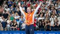 The Netherlands' Liesette Bruinsma celebrates on the podium with her gold medal after winning the Women's 400m S11 Freestyle swimming during the Paris 2024 Paralympics at the Paris La Defense Arena in Paris, on August 30, 2024. 
Ian RICE / AFP