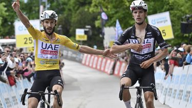 epa11412613 Adam Yates from Great Britain of UAE Team Emirates (L) wins ahead of Joao Almeida from Portugal of UAE Team Emirates during the Tour de Suisse's seventh stage, a 118.2km cycling race from Villars-sur-Ollon to Villars-sur-Ollon, Switzerland, 15 June 2024.  EPA/GIAN EHRENZELLER