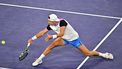 Denmark's Holger Rune plays a backhand return at the net to Russia's Daniil Medvedev during their ATP-WTA Indian Wells Masters men's quarter final tennis match at the Indian Wells Tennis Garden in Indian Wells, California, on March 14, 2024. 
Frederic J. BROWN / AFP