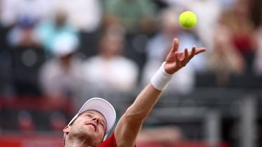 Netherlands' Botic van de Zandschulp serves against US player Tommy Paul during their men's singles round of 16 tennis match on day three of the ATP HSBC Championships at Queen's Club in west London on June 18, 2026. 
Henry Nicholls / AFP