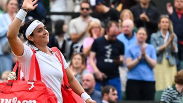 Tunisia's Ons Jabeur waves to the crowd as she leaves Centre Court after loosing against  Ukraine's Elina Svitolina during their women's singles tennis match on the sixth day of the 2024 Wimbledon Championships at The All England Lawn Tennis and Croquet Club in Wimbledon, southwest London, on July 6, 2024. 
ANDREJ ISAKOVIC / AFP