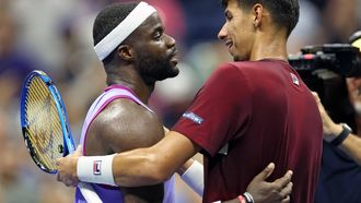 USA's Frances Tiafoe (L) greets Australia's Alexei Popyrin after his victory during their men's singles round of 16 tennis match on day seven of the US Open tennis tournament at the USTA Billie Jean King National Tennis Center in New York City, on September 1, 2024. 
CHARLY TRIBALLEAU / AFP