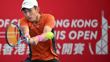 China’s Shang Juncheng hits a return to USA’s Frances Tiafoe during their men's quarter-final singles tennis match at the Hong Kong Open in Hong Kong on January 5, 2024. 
Peter PARKS / AFP