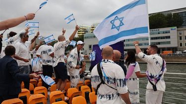 Paris 2024 Olympics - Opening Ceremony - Paris, France - July 26, 2024. Athletes of Israel including flagbearers Andrea Murez and Peter Paltchik are seen aboard a boat in the floating parade on the river Seine during the opening ceremony. 
Nir Elias / POOL / AFP