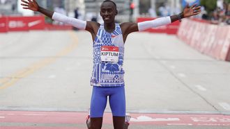 (FILES) Kenya's Kelvin Kiptum celebrates winning the 2023 Bank of America Chicago Marathon in Chicago, Illinois, in a world record time of two hours and 35 seconds on October 8, 2023.  World marathon record holder Kelvin Kiptum and his coach Gervais Hakizimana have died in a car crash in western Kenya that left a third passenger also injured, police said on February 11, 2024.
KAMIL KRZACZYNSKI / AFP