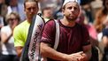 Netherlands' Tallon Griekspoor (front) reacts, past Germany's Alexander Zverev in background as he leaves the court after withdrawing from his men's singles match on day 9 of the French Open tennis tournament on Court Suzanne-Lenglen at the Roland-Garros Complex in Paris on June 2, 2025. 
Dimitar DILKOFF / AFP
