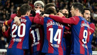 Barcelona's Brazilian forward #11 Raphinha celebrates with teammates after scoring his team's first goal during the Spanish league football match between FC Barcelona and UD Almeria at the Estadi Olimpic Lluis Companys in Barcelona on December 20, 2023. 
Josep LAGO / AFP