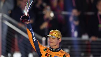 Second place finisher McLaren's British driver Lando Norris holds his trophy on the podium after the Las Vegas Formula One Grand Prix at the Las Vegas Strip Circuit in Las Vegas, Nevada, on November 22, 2025. Formula One world champion Max Verstappen produced a masterful drive to win the Las Vegas Grand Prix on Saturday as McLaren's Lando Norris finished second to edge closer to a maiden drivers' title.
Red Bull ace Verstappen pounced on a slip by pole-sitter Norris on the first turn of Sin City's street circuit to grab the lead and controlled the race thereafter to claim the 69th Grand Prix win of his career, finishing more than 20 seconds clear.

Patrick T. Fallon / AFP