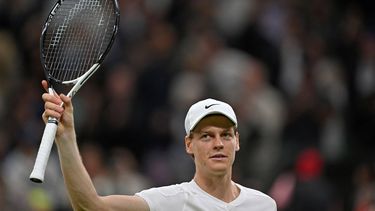 Italy's Jannik Sinner celebrates winning against Italy's Matteo Berrettini during their men's singles second round tennis match on the third day of the 2024 Wimbledon Championships at The All England Lawn Tennis and Croquet Club in Wimbledon, southwest London, on July 3, 2024. Sinner won the Match 7-6, 7-6, 2-6, 7-4. 
ANDREJ ISAKOVIC / AFP