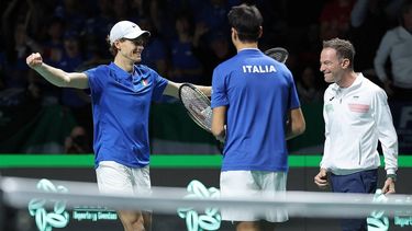 2023-11-25 20:12:04 Italy's Jannik Sinner (L), Lorenzo Sonego (C) and Italy's captain Filippo Volandri celebrate after winning against Serbia's Novak Djokovic and Momir Kecmanovic during the men's doubles semifinal tennis match between Italy and Serbia of the Davis Cup tennis tournament at the Martin Carpena sportshall, in Malaga on November 25, 2023. 
LLUIS GENE / AFP
