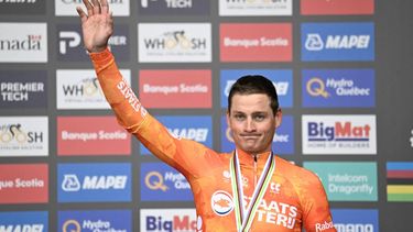 Third-placed Netherland's Mathieu van der Poel celebrates on the podium of the Men Elite Road Race during the 2026 Union Cycliste Internationale (UCI) Road World Championships in Montreal, Quebec, on September 27, 2026. 
Andrej Ivanov / AFP