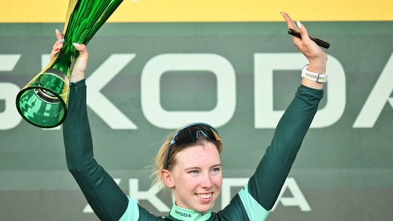 Team SD Worx-Protime's Dutch rider Lorena Wiebes celebrates on the podium wearing the best sprinter's green jersey after the 9th and final stage of the fifth edition of the Women's Tour de France cycling race, 99.2 km from Nice to Nice, southeastern France on August 9, 2026. 
NICOLAS TUCAT / AFP