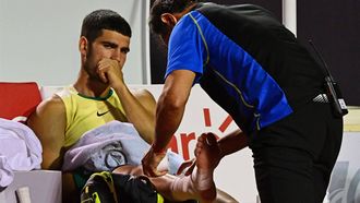 Spain's Carlos Alcaraz gestures after suffering an injury during the ATP 500 Rio Open tennis match against Brazil's Carlos Monteiro in Rio de Janeiro, Brazil on February 20, 2024. 
Pablo PORCIUNCULA / AFP