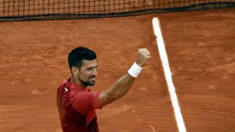 epa11388076 Novak Djokovic of Serbia celebrates winning his men's singles Round of 16 match against Francisco Cerundolo of Argentina at the French Open Grand Slam tennis tournament at Roland Garros in Paris, France, 03 June 2024.  EPA/YOAN VALAT