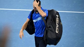 epa11803665 Novak Djokovic of Serbia getstures as he walks off the court after losing his quarter-finals match against Reilly Opelka of USA at the Brisbane International tennis tournament in Brisbane, Australia, 03 January 2025.  EPA/DARREN ENGLAND AUSTRALIA AND NEW ZEALAND OUT