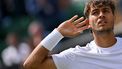 Italy's Flavio Cobolli gestures towards the crowd for cheering as he plays against during their men's singles fourth round tennis match on the eighth day of the 2025 Wimbledon Championships at The All England Lawn Tennis and Croquet Club in Wimbledon, southwest London, on July 7, 2025. 
Glyn KIRK / AFP