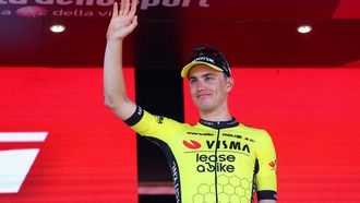 Team Visma–Lease a Bike's Dutch rider Olav Kooij celebrates on the podium after winning the 9th stage of the 107th Giro d'Italia cycling race, 214km between Avezzano and Naples, on May 12, 2024.  
Luca Bettini / AFP