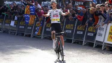 epa11239181 The overall leader, Slovenian rider Tadej Pogacar of UAE Emirates Team crosses the line to win the sixth stage of the Volta Ciclista a Catalunya over 154.7km km from Berga to Queralt, Catalonia, Spain, 23 March 2024.  EPA/Quique Garcia