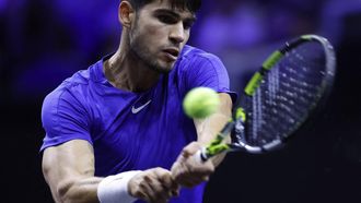 Spain's Carlos Alcaraz of Team Europe returns the ball to USA's Taylor Fritz of Team World during their 2024 Laver Cup men's singles tennis match in Berlin, Germany on September 22, 2024. 
Odd ANDERSEN / AFP