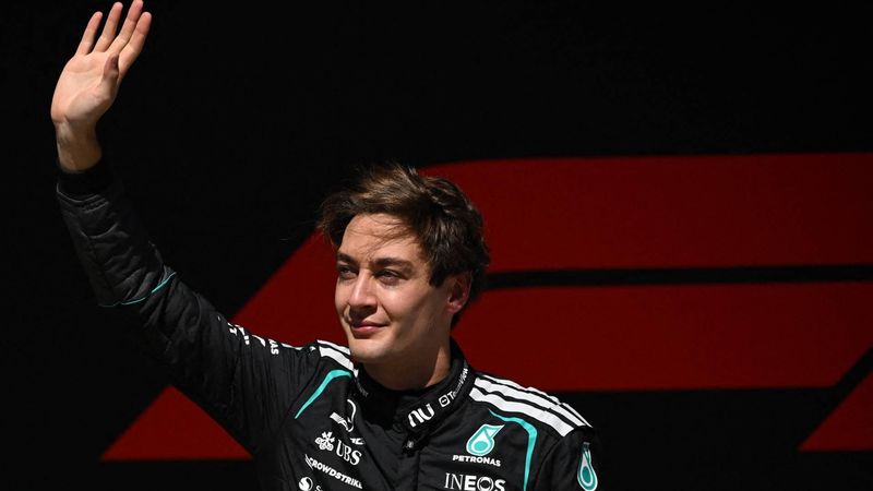 Mercedes' British driver George Russell celebrates winning the sprint race ahead of the Formula One Chinese Grand Prix at the Shanghai International Circuit in Shanghai on March 14, 2026. 
JADE GAO / AFP