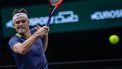 2023-10-30 21:29:47 epa10949457 Taylor Fritz of the US in action against Sebastian Baez of Argentina during their first round match at the Rolex Paris Masters tennis tournament in Paris, France, 30 October 2023.  EPA/CHRISTOPHE PETIT TESSON