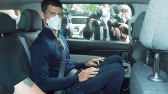 epa09688461 Serbian tennis player Novak Djokovic (C) departs from the Park Hotel government detention facility before attending a court hearing at his lawyers office in Melbourne, Australia, 16 January 2022. Novak Djokovic still faces uncertainty as to whether he can compete in the Australian Open, despite being announced in the tournament draw.  EPA/JAMES ROSS NO ARCHIVING AUSTRALIA AND NEW ZEALAND OUT