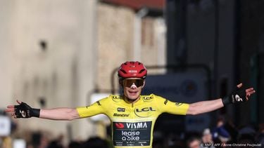 Team Visma - Lease a Bike's Danish rider Jonas Vingegaard celebrates as he crosses crossing the finish to win the 5th stage of the Paris-Nice cycling race, 206.3 km between Cormoranche-sur-Saône and Colombier-le-Vieux, on March 12, 2026. 
Anne-Christine POUJOULAT / AFP