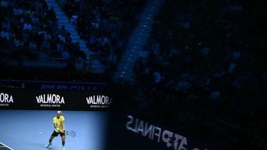 Spain's Carlos Alcaraz hits a return during his match against Australia's Alex De Minaur at the ATP Finals tennis tournament in Turin on November 9, 2025. 
Marco BERTORELLO / AFP