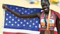 USA's bronze medallist Athing Mu celebrates with her medal and national flag after the women's 800m final during the World Athletics Championships at the National Athletics Centre in Budapest on August 27, 2023. 
Attila KISBENEDEK / AFP